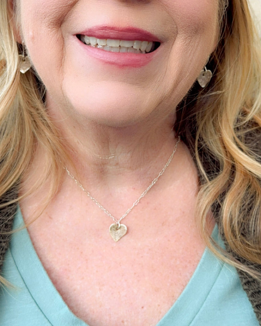 Heart shaped necklace made of Malibu Beach sand on fine silver