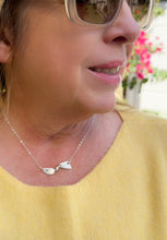 Load image into Gallery viewer, Sterling silver necklace with a center piece twisted like a ribbon
