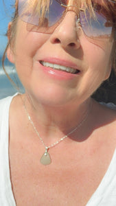 Sea glass pendant in aqua with a sterling silver chain
