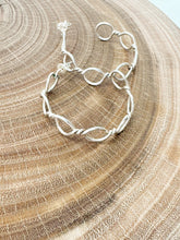 Load image into Gallery viewer, A sterling silver pair of earrings in a chainlink design
