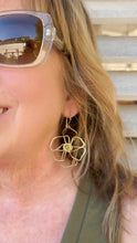 Load image into Gallery viewer, Large matisse inspired earrings in brass on a woman
