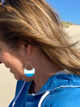 Load image into Gallery viewer, Enamel Earrings 1/2 moon shape blue on a model
