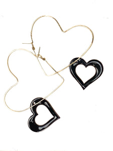 Heart shaped hoops with a reversible black/red heart charm